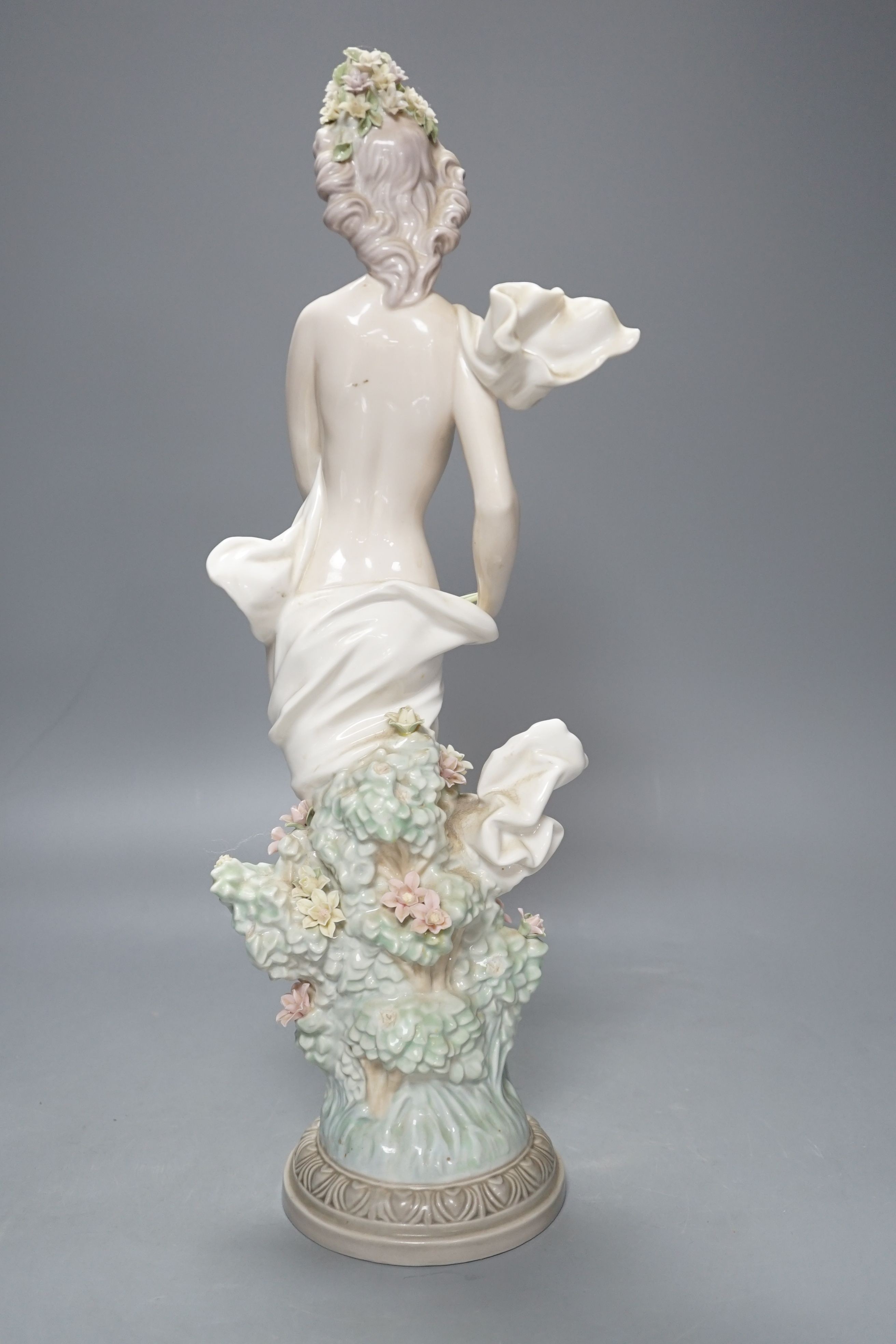 A Lladro female figurine, decorators signature on base, No 401, 41 cms.